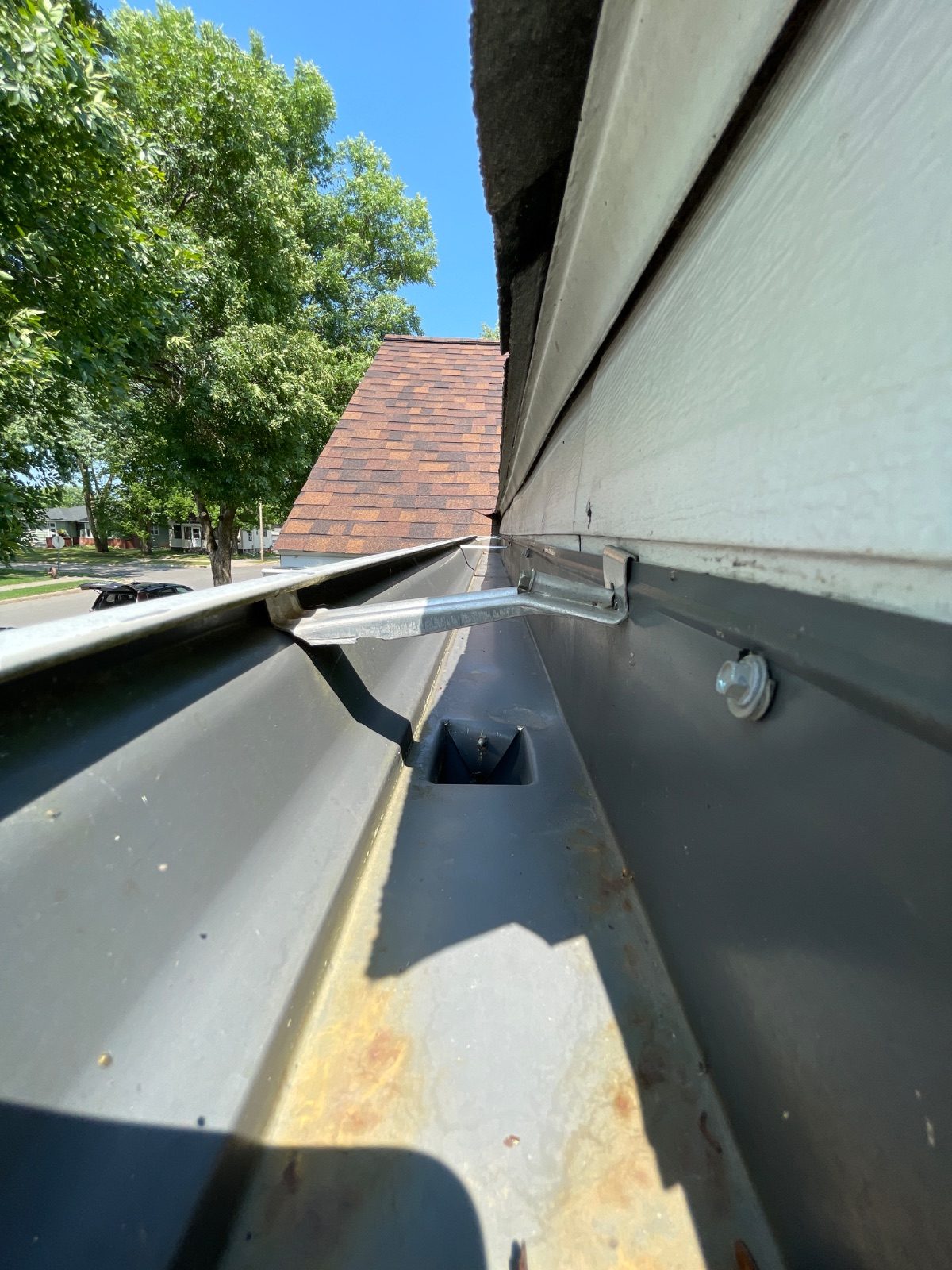 Cleaned gutter and flushed downspout on a home in Duluth, Minnesota