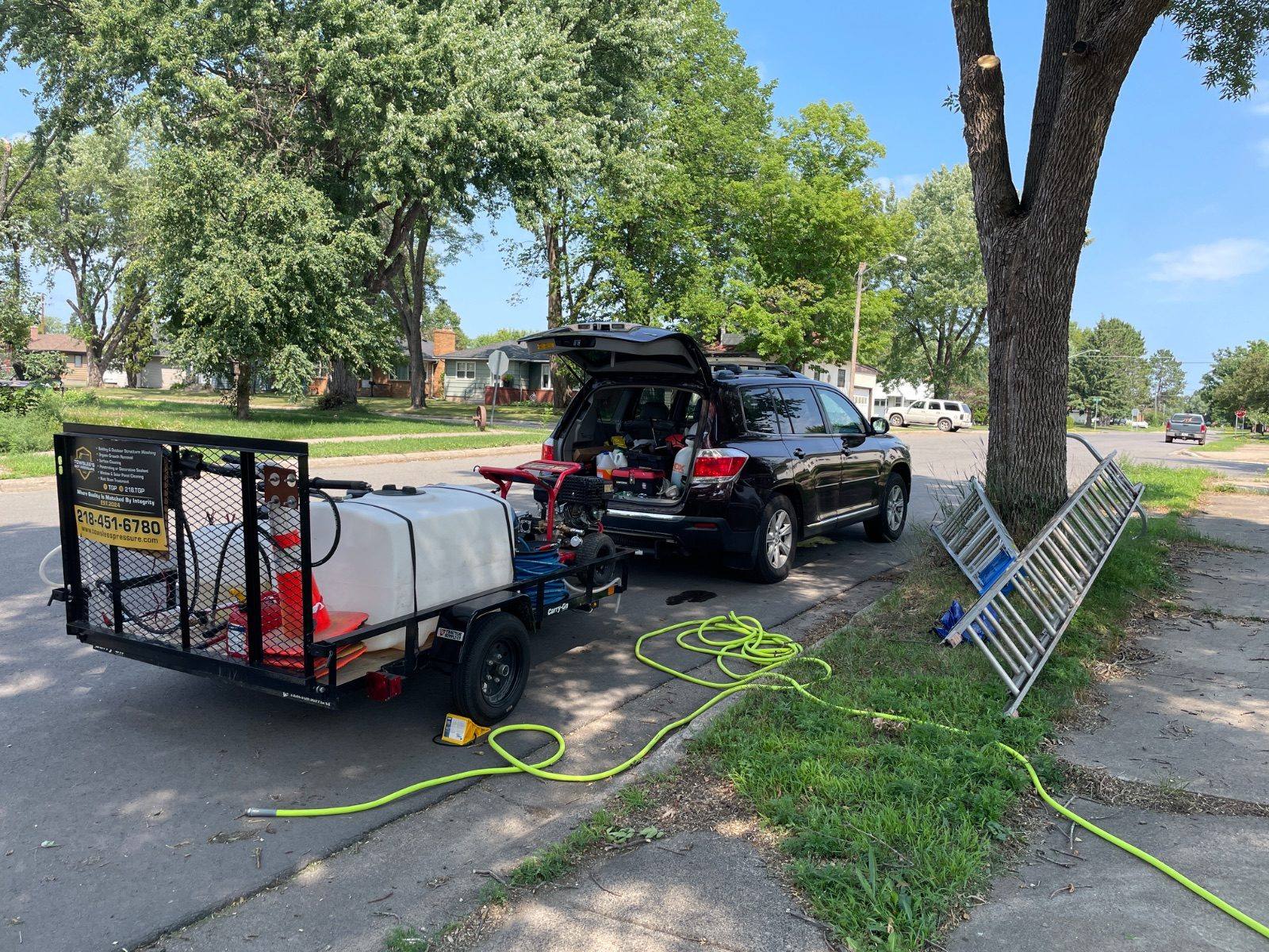 Towslee's Got Pressure work trailer and equipment on site in Duluth, Minnesota